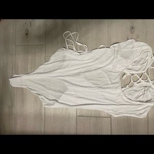 white body suit with lace up back (material is see through)